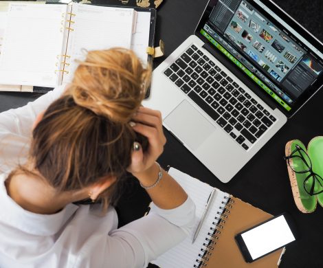 Woman Sitting in Front of Macbook